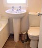 Fowey Cottage Bathroom: wash hand basin and w/c